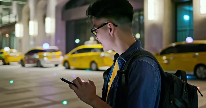 man use taxi app outdoor