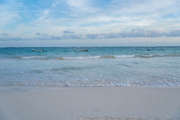 Boats docked in beautiful beach in Tulum Mexico North America