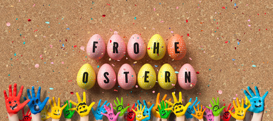 easter eggs with message HAPPY EASTER in German on cork background