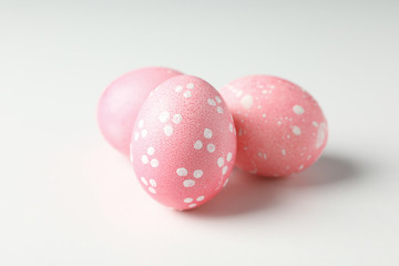 Pink easter eggs on white background, close up