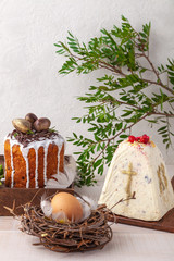 Easter cake, flowers and egg on white background
