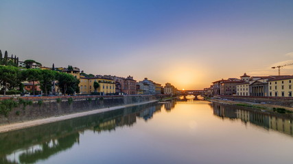 Fototapeta na wymiar Sunset view of Florence Ponte Vecchio over Arno River in Florence timelapse, Italy.