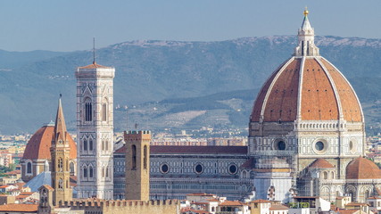 Fototapeta na wymiar Duomo Santa Maria Del Fiore timelapse and Bargello in the morning from Piazzale Michelangelo in Florence, Tuscany, Italy