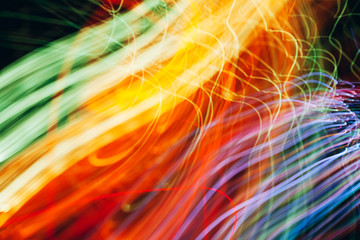 Abstract light pattern. Blurred neon lights. A dynamic backdrop for your design