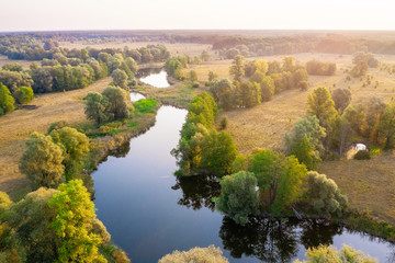 Picturesque rural view of River Psel in Ukraine, flowing through plains and flood meadows. Amazing sunrise landscape of Ukrainian nature. Beautiful summer scenery.