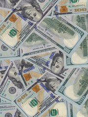 Hundred dollar bills or banknotes background. American money full background close-up and flat lay.