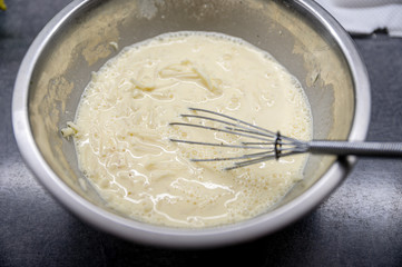 Mixed eggs with cheese. Raw ingredients, cooking from above, flat lay.