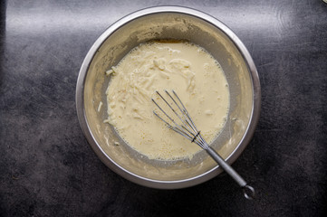 Mixed eggs with cheese. Raw ingredients, cooking from above, flat lay.