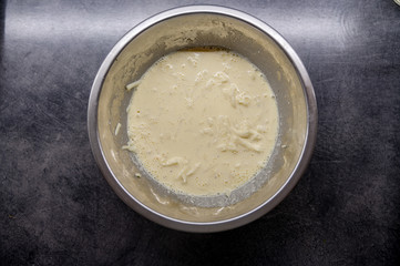 Mixed eggs with cheese. Raw ingredients, cooking from above, flat lay.