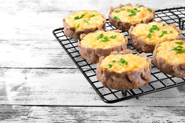 Mini pies with rye dough and mashed potato filling on the metallic lattice. Karelian Kalitki, Russian cuisine meal