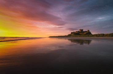 Castle next to the ocean at sunrise