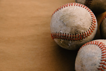 Old baseball background with used balls balls closeup on vintage texture background, copy space for sport.