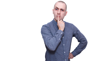 young man with raised eyebrow thinking