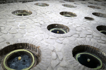 Kvevris being buried in winery