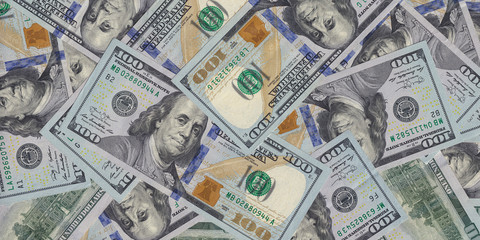 Hundred dollar bills or banknotes background. American money full background close-up and flat lay. Wide panoramic web banner.