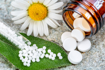 Fototapeta na wymiar alternative medicine with herbal and homeopathic pills