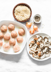 Ingredients for cooking orzo mushrooms pasta with teriyaki sauce chicken roasted meatballs on a light background, top view