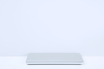 Laptop computer on grey background