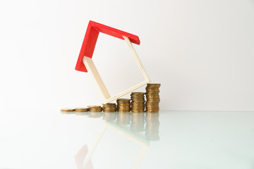 high key. business and finance management conceptual images. stacked money and home replica ...