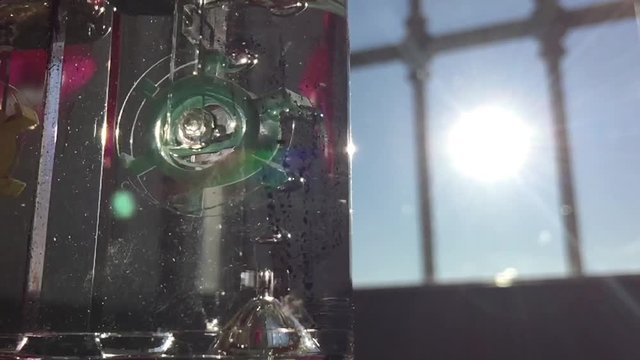 slow motion of water games, sky and sun in the background
