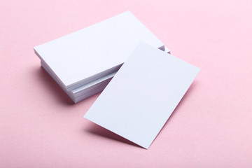 Blank business cards on pink background