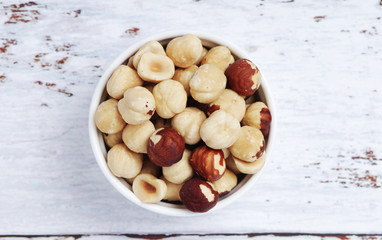 A bowl with shelled hazel nuts	
