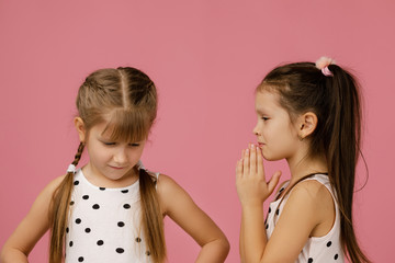 the two girlfriends quarreled. one girl is offended, and the second apologizes.