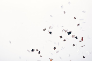 Falling solver confetti on neutral grey backdrop.