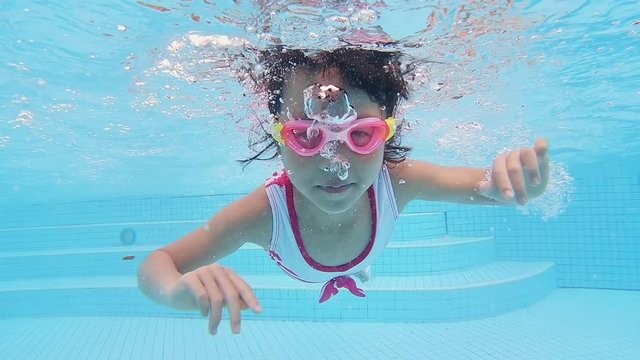 asian girl swimming breaststroke