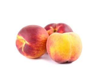 Fresh peaches isolated on white background