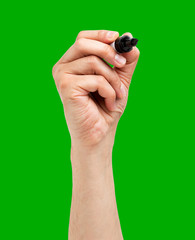 Man hand drawing in the air with a black marker on a green isolated background