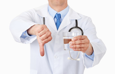 doctor hands holding a water glass with thumbs down