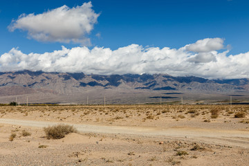 white clouds on the tops of mountains in the region of Issyk-Kul Lake, Kyrgyzstan