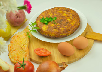 Spanish potato omelette accompanied by bread with tomato and typical Catalan oil
