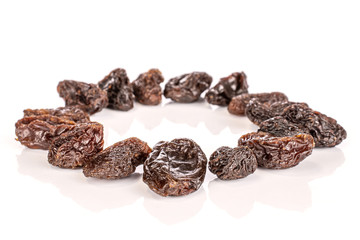 Lot of whole dried dark raisin circle isolated on white background