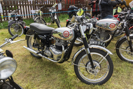 Vintage BSA motorbikes on display at a vehicle rally