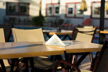 Tables and chairs in street cafe
