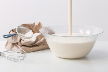 dough in glass plate and products for its preparation on  white