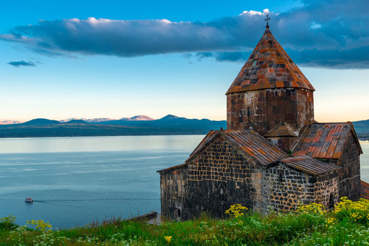 Sevanavank Monastery and Lake Sevan. Dramatic sky at sunset, Armenia
