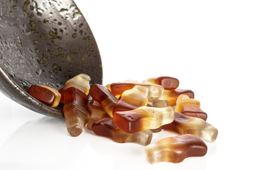Lot of whole sweet sweet jelly cola in glazed bowl isolated on white background