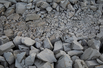 Different size crushed grey stones material textures