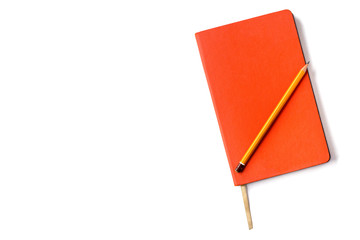 Stylish orange leather day planner and a pencil isolated on white background