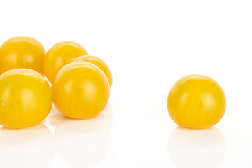 Group of six whole fresh yellow tomato isolated on white background