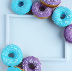 multicolored donuts in a basket with icing, top view, side view