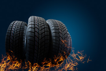 Car tires stand on a road