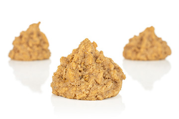 Group of three whole homemade brown coconut biscuit with chocolate isolated on white background