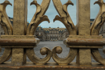gates to the castle in verssailles france
