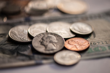 US american 100 bill bank note with coins 