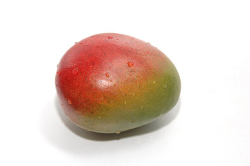 Mango with water drops on isolated white background. Freshness, diet and healty food, tropical fruit