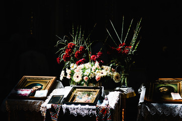 Bible, ikon, bowl on table in church ready for marriage ceremony. close up.